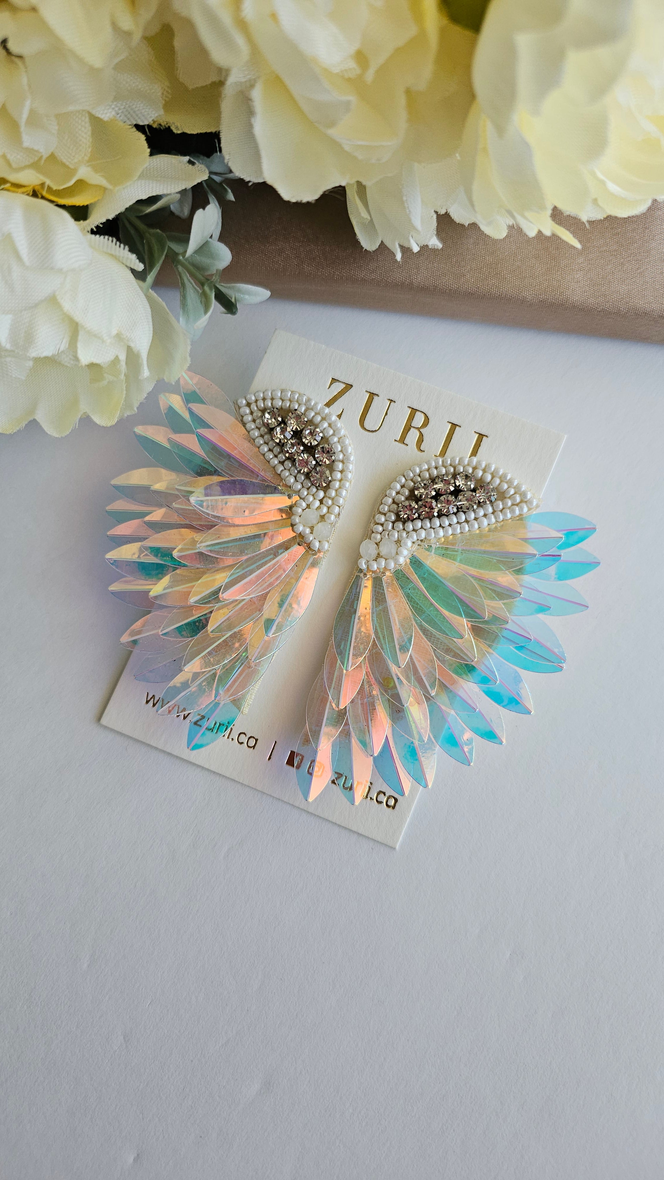 Iridescent Angel Wings Earrings by Zurii – Handmade ethical Earrings from sariKNOTsari using upcycled silk. Designed in Canada for travel and slow fashion, loved from Toronto to LA to Sydney. Featuring Zsiska, Bryn Walker and Artisan Leather coats by Rejean Pepin, Pepin designs