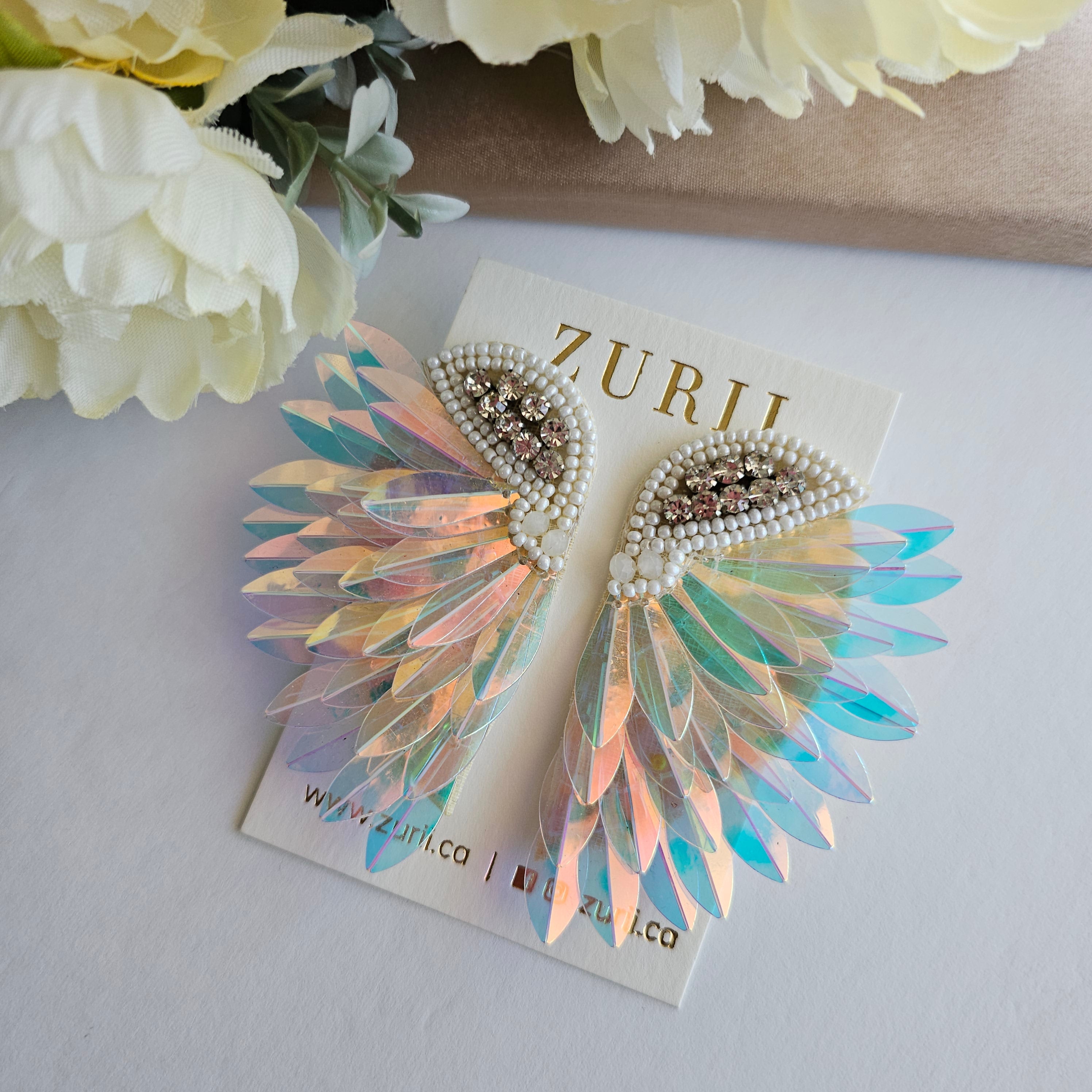 Iridescent Angel Wings Earrings by Zurii – Handmade ethical Earrings from sariKNOTsari using upcycled silk. Designed in Canada for travel and slow fashion, loved from Toronto to LA to Sydney. Featuring Zsiska, Bryn Walker and Artisan Leather coats by Rejean Pepin, Pepin designs