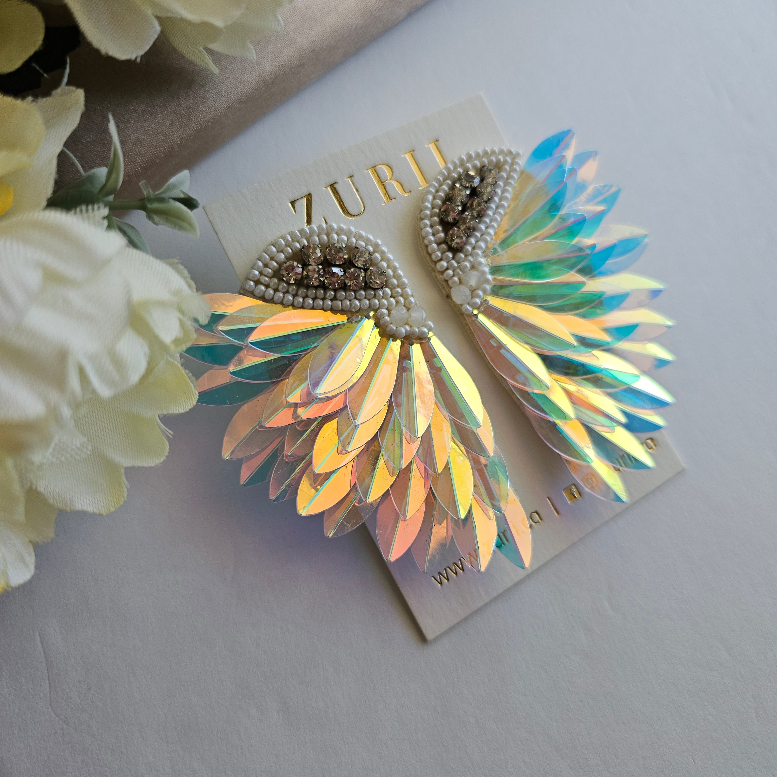 Iridescent Angel Wings Earrings by Zurii – Handmade ethical Earrings from sariKNOTsari using upcycled silk. Designed in Canada for travel and slow fashion, loved from Toronto to LA to Sydney. Featuring Zsiska, Bryn Walker and Artisan Leather coats by Rejean Pepin, Pepin designs