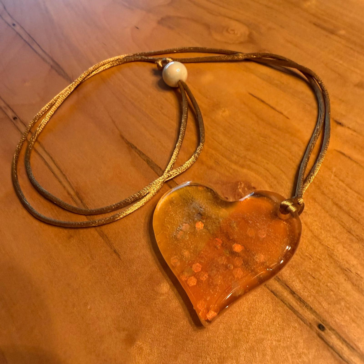 Happy Heart Pendant by Kristine’s Kreations – Handmade ethical Necklace from sariKNOTsari using upcycled silk. Designed in Canada for travel and slow fashion, loved from Toronto to LA to Sydney. Featuring Zsiska, Bryn Walker and Artisan Leather coats by Rejean Pepin, Pepin designs