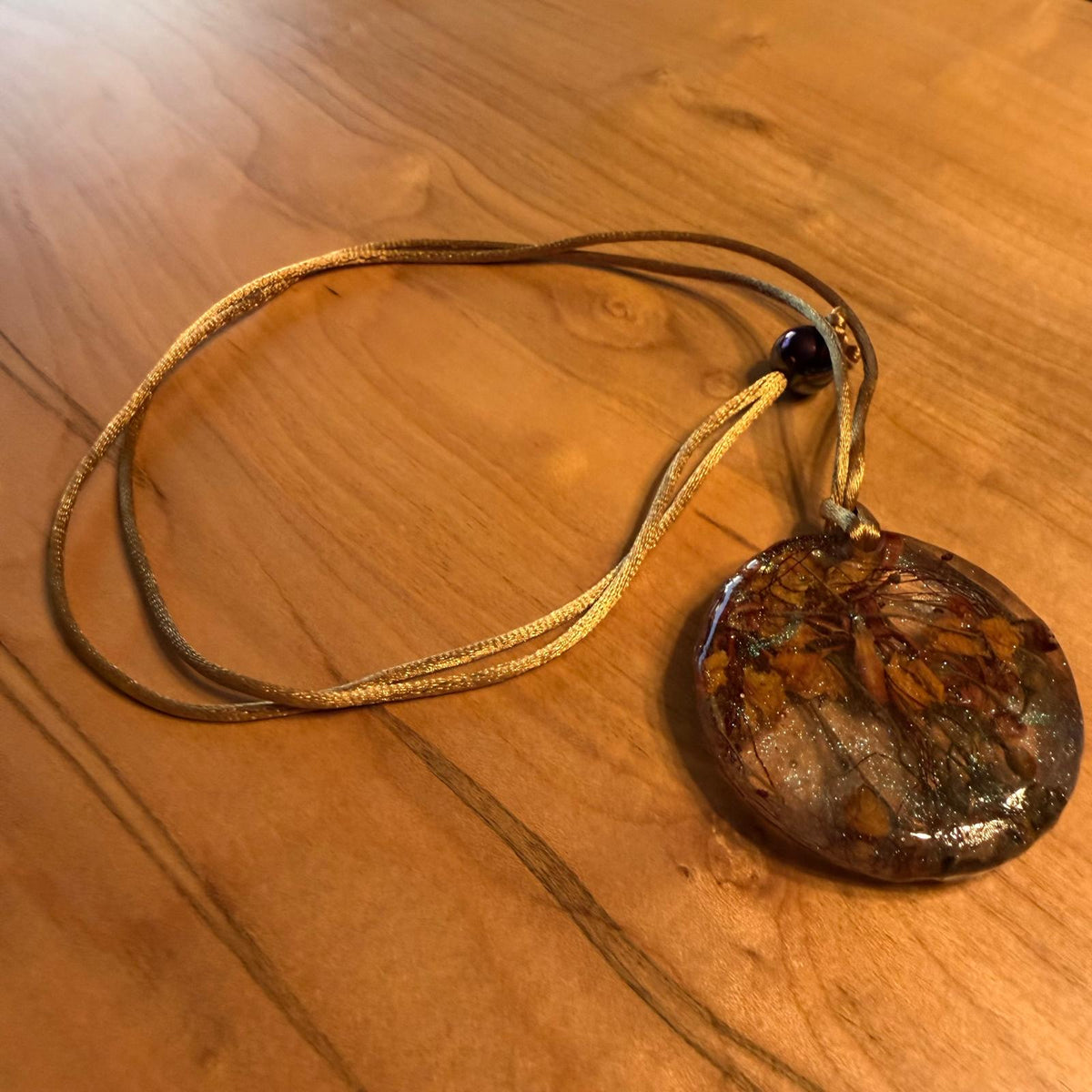 Peacock Flower Pendant by Kristine’s Kreations – Handmade ethical Necklace from sariKNOTsari using upcycled silk. Designed in Canada for travel and slow fashion, loved from Toronto to LA to Sydney. Featuring Zsiska, Bryn Walker and Artisan Leather coats by Rejean Pepin, Pepin designs