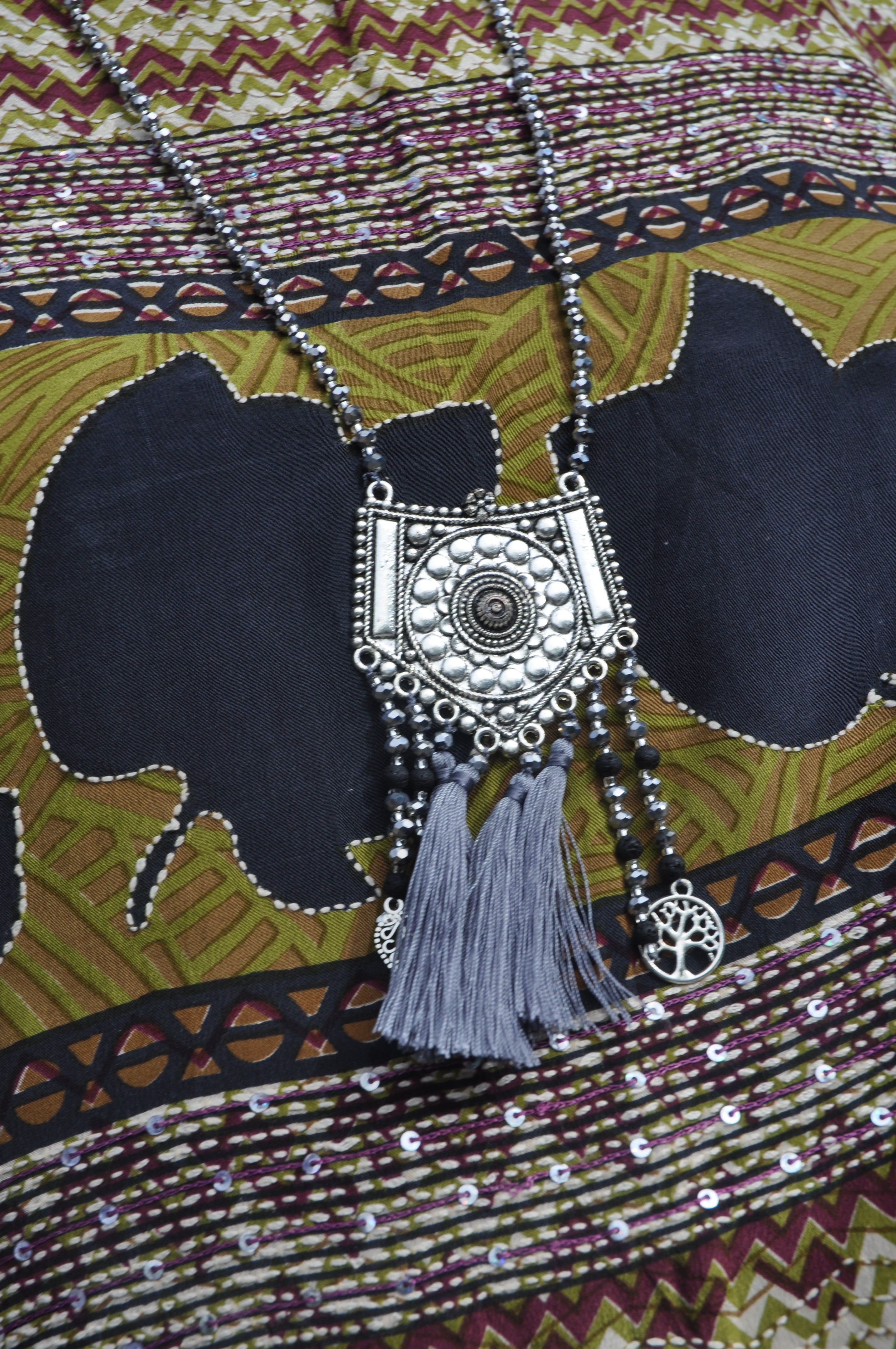 Long Crystal Grey Necklace with With Patterned Metal Pendant