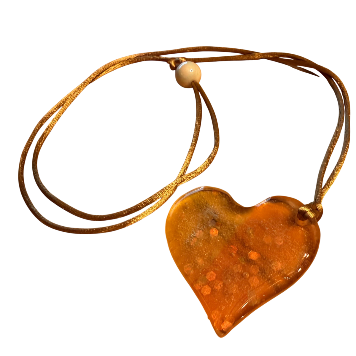 Happy Heart Pendant by Kristine’s Kreations – Handmade ethical Necklace from sariKNOTsari using upcycled silk. Designed in Canada for travel and slow fashion, loved from Toronto to LA to Sydney. Featuring Zsiska, Bryn Walker and Artisan Leather coats by Rejean Pepin, Pepin designs
