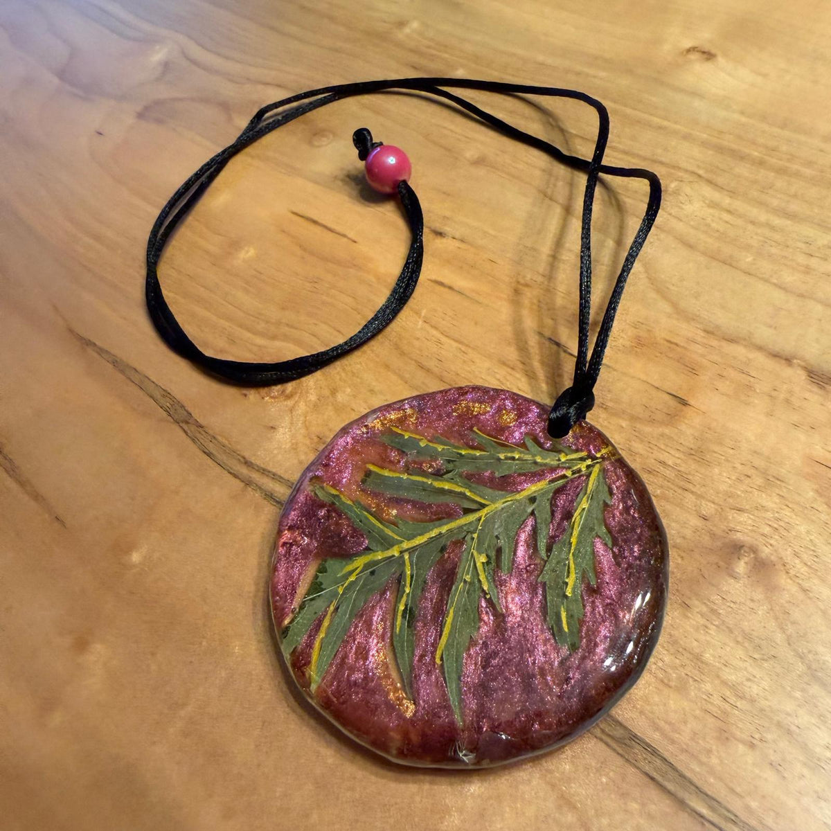Lacy Leaf Pendant by Kristine’s Kreations – Handmade ethical Necklace from sariKNOTsari using upcycled silk. Designed in Canada for travel and slow fashion, loved from Toronto to LA to Sydney. Featuring Zsiska, Bryn Walker and Artisan Leather coats by Rejean Pepin, Pepin designs