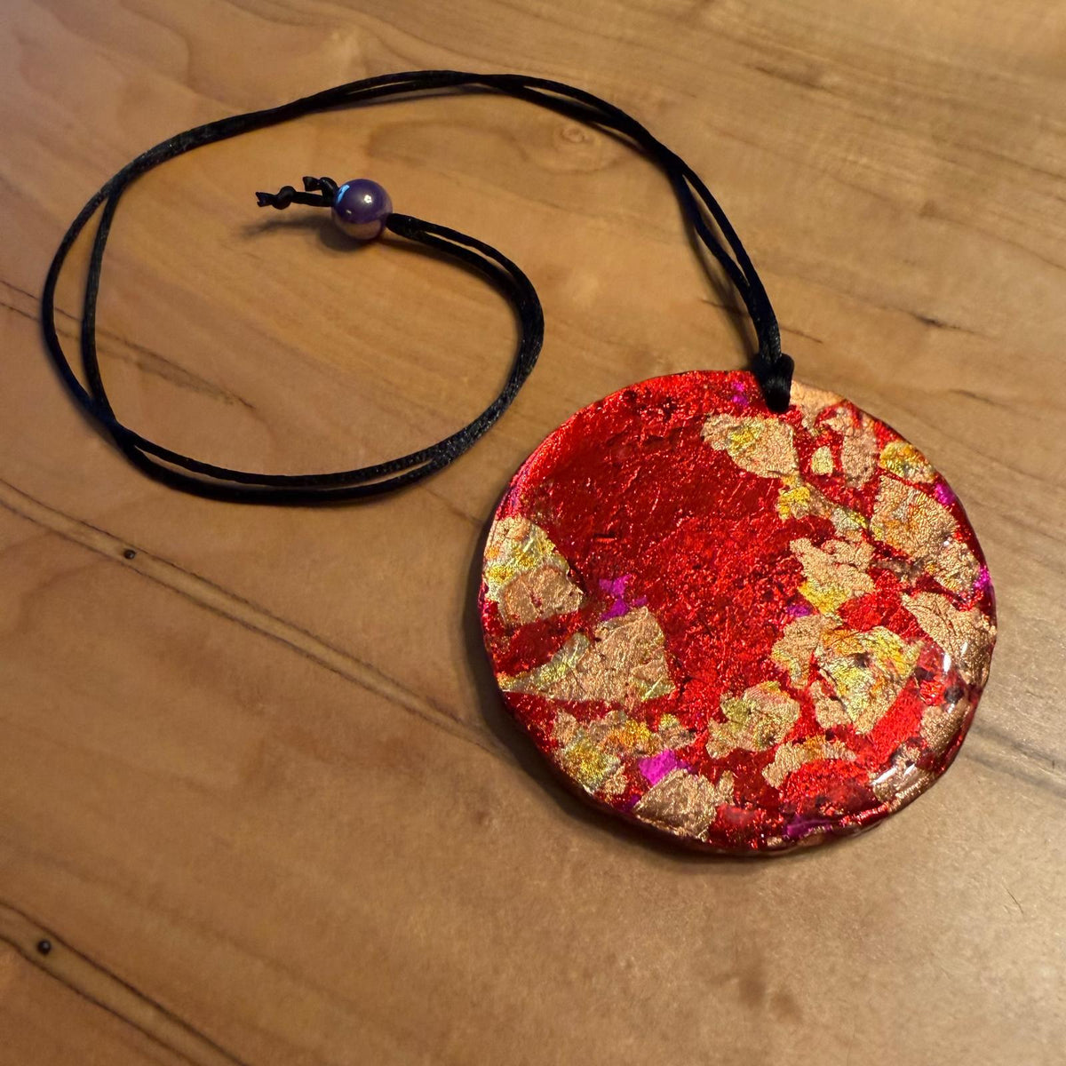 Lava Flow Pendant by Kristine’s Kreations – Handmade ethical Necklace from sariKNOTsari using upcycled silk. Designed in Canada for travel and slow fashion, loved from Toronto to LA to Sydney. Featuring Zsiska, Bryn Walker and Artisan Leather coats by Rejean Pepin, Pepin designs